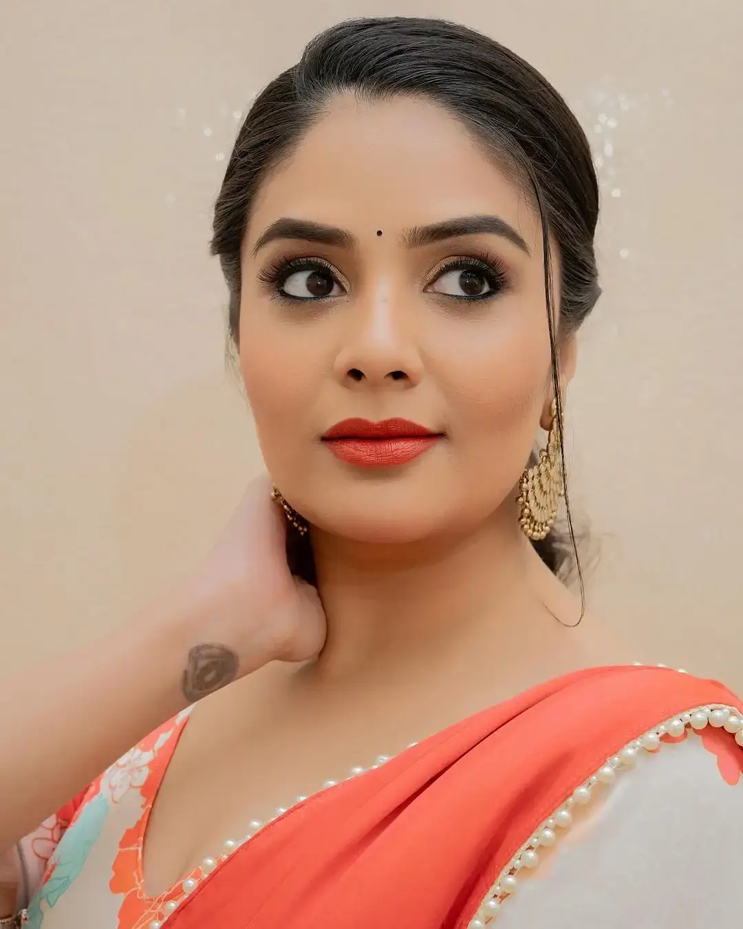 Beautiful Indian Actress Sreemukhi in Orange Lehenga Choli